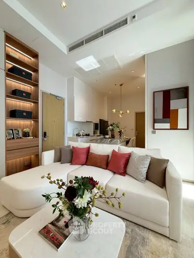 Luxurious modern living room with elegant decor and open kitchen layout