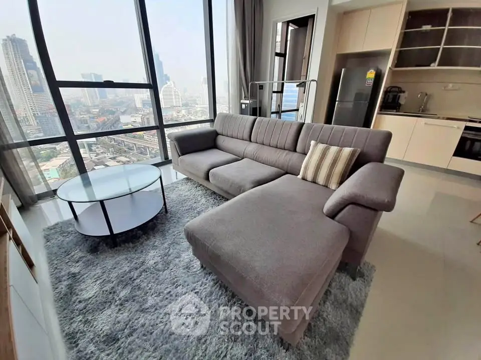 Spacious modern living room with panoramic city views and stylish furniture