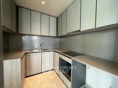 Modern kitchen with sleek cabinetry and integrated appliances