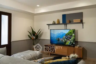 Stylish living room with modern TV setup and elegant decor