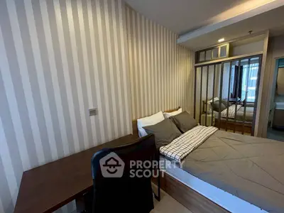 Cozy bedroom with modern decor and workspace in stylish apartment