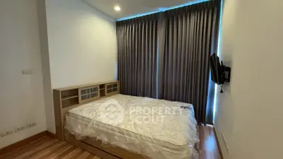 Cozy bedroom with modern furnishings and natural light