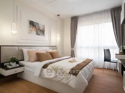 Elegant bedroom with modern decor and natural light, featuring cozy bedding and stylish furnishings.