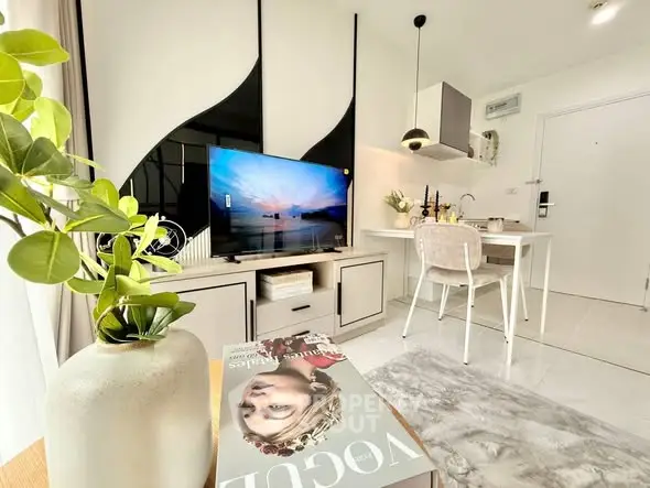 Modern living room with stylish decor and open kitchen layout