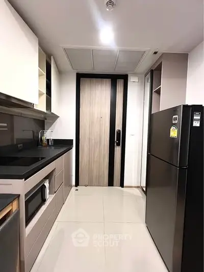 Modern kitchen with sleek appliances and closed layout design