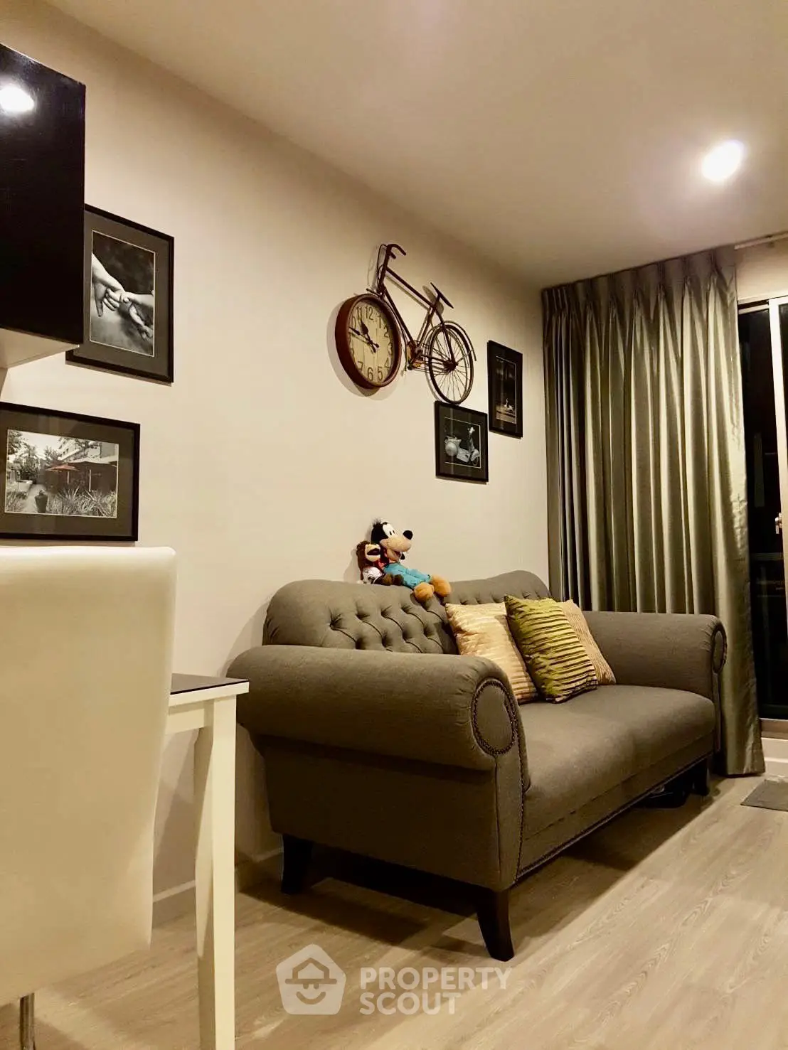 Cozy living room with stylish decor and plush sofa, perfect for relaxation and entertaining guests.
