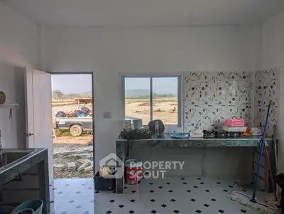 Spacious kitchen with open layout and scenic countryside view