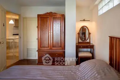 Cozy bedroom with wooden furniture and soft lighting