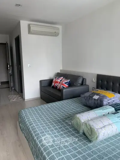 Modern bedroom with stylish decor and air conditioning in a cozy apartment.