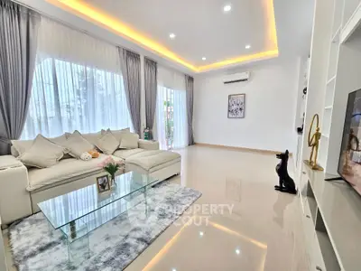 Spacious modern living room with elegant decor and large windows