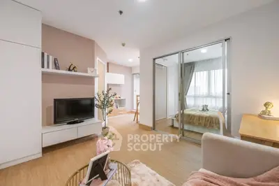 Modern living room with open layout and cozy bedroom view