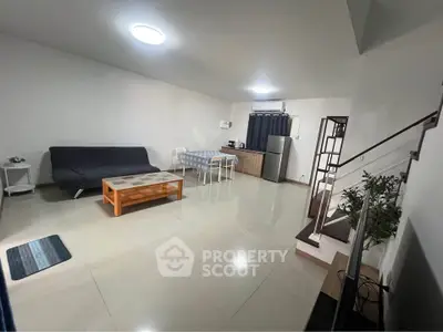 Spacious modern living room with sleek furniture and open layout