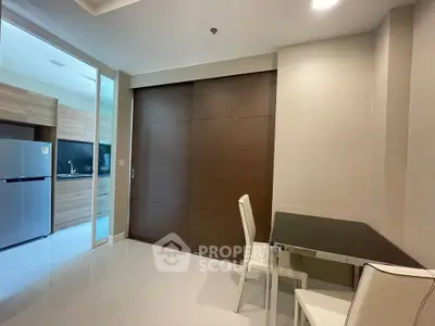 Modern kitchen and dining area with sleek design and stainless steel appliances