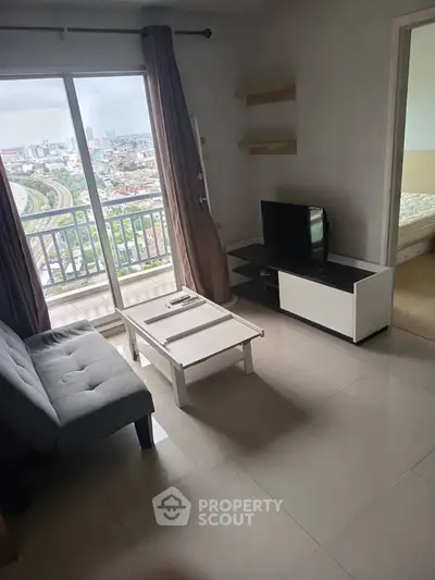 Modern living room with balcony view in high-rise apartment