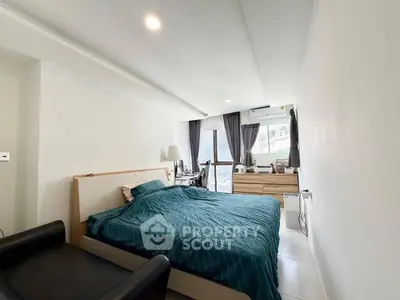 Modern bedroom with stylish decor and natural light