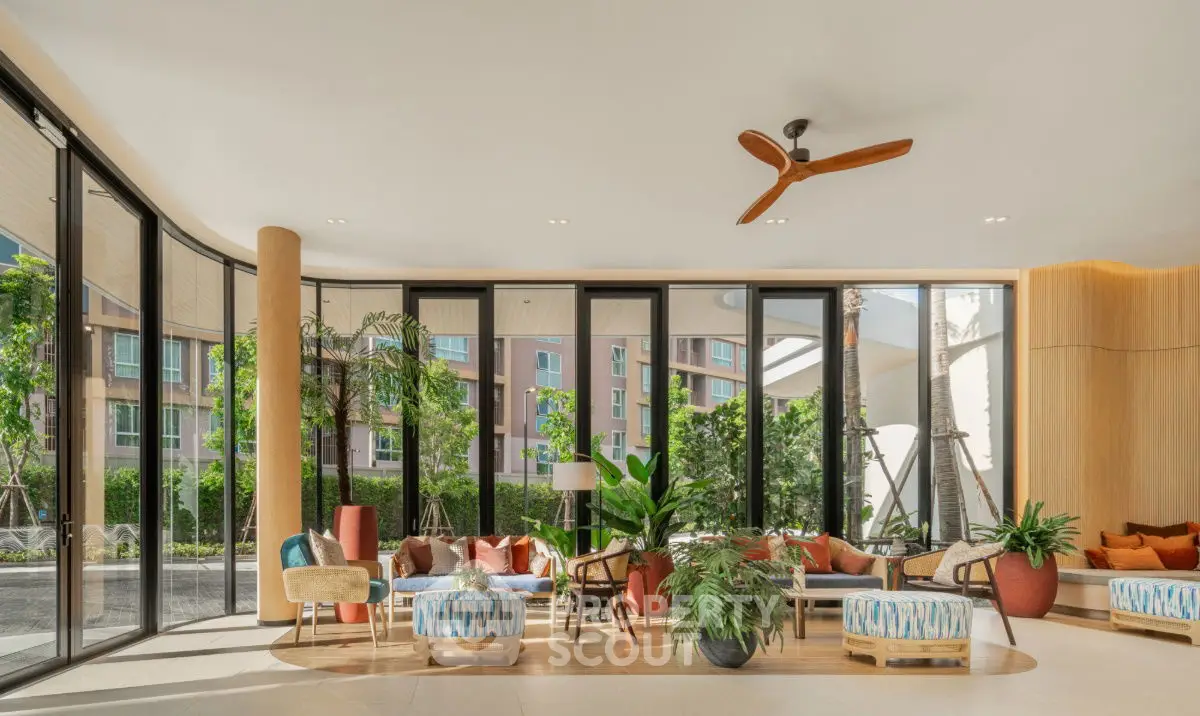 Spacious modern living room with large windows and stylish decor