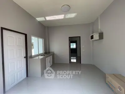 Modern minimalist kitchen with sleek design and ample natural light