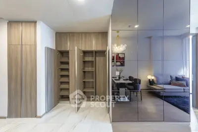 Modern living room with sleek storage and elegant dining area