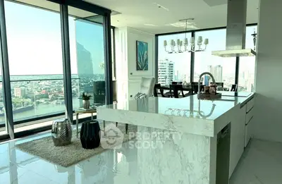 Luxurious open-plan kitchen with stunning city view and modern decor