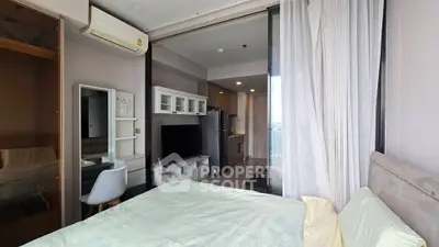 Modern bedroom with open layout and stylish decor in a contemporary apartment.