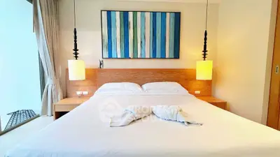 Luxurious bedroom with modern decor and cozy lighting in a stylish apartment.