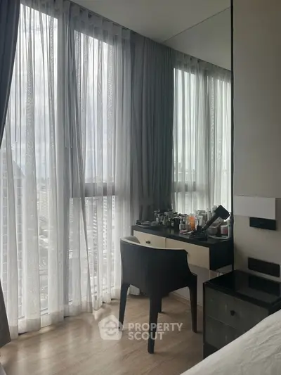 Chic bedroom with city view and elegant vanity setup
