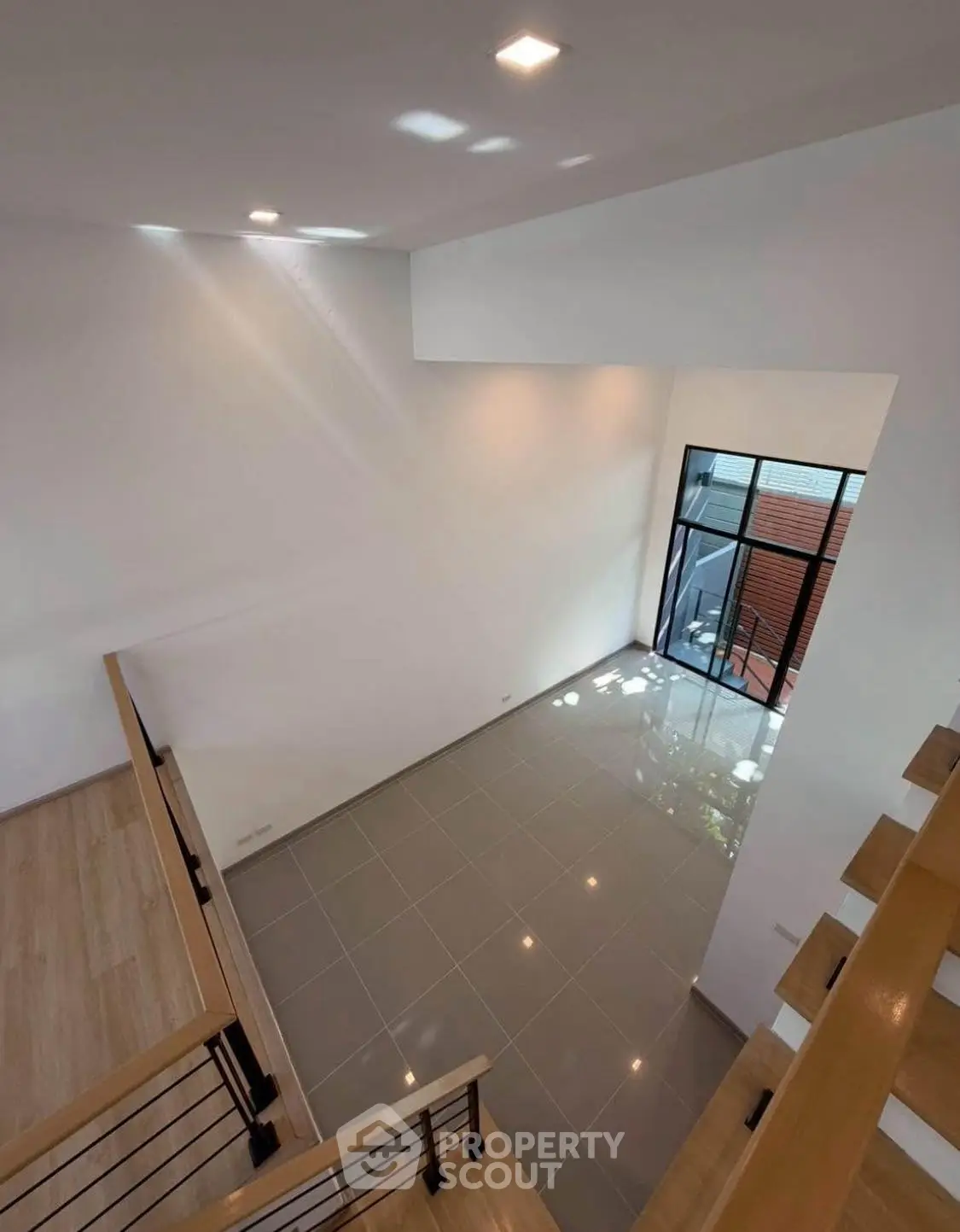 Spacious modern interior with high ceiling and large windows