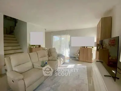 Spacious living room with modern furniture and natural light