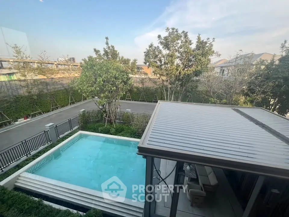 Luxurious property with private pool and lush garden view, perfect for relaxation and entertainment.