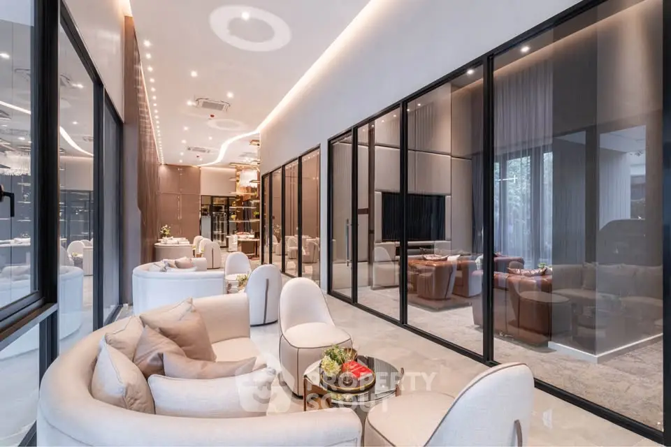 Luxurious modern living room with elegant furniture and glass partitions
