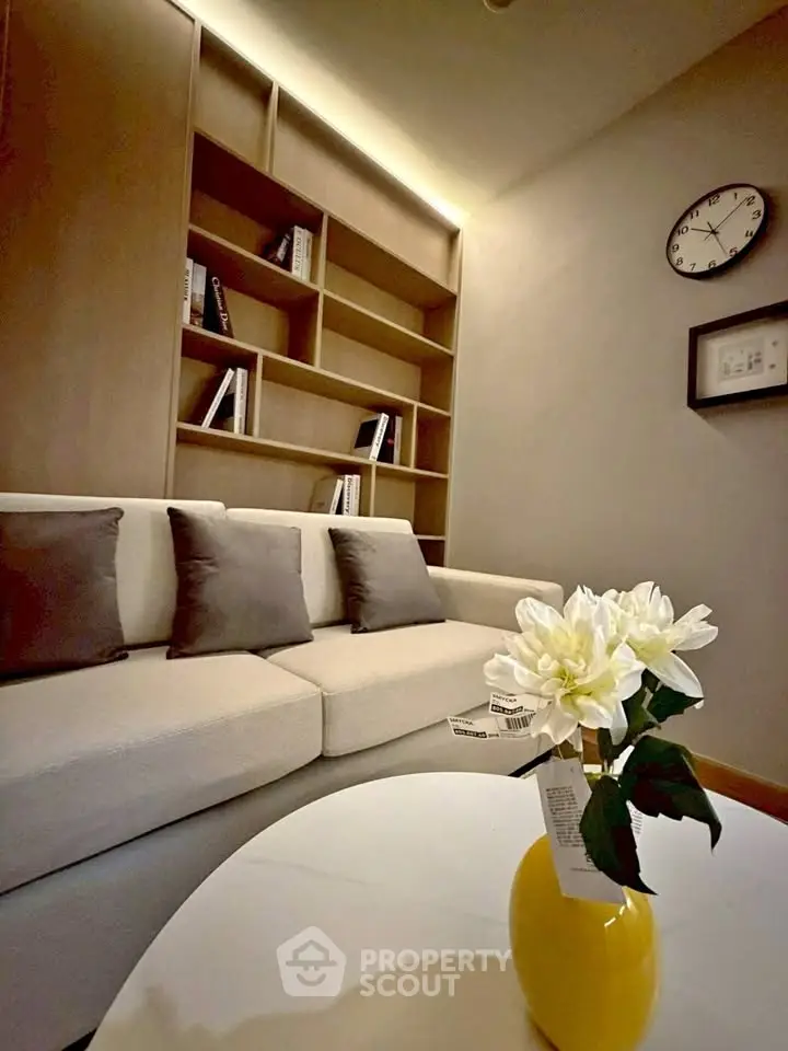Modern living room with cozy sofa, stylish bookshelf, and elegant decor