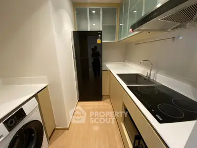 Modern kitchen with sleek appliances and ample storage space