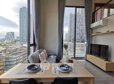 Modern living room with city view, featuring sleek furniture and large windows.