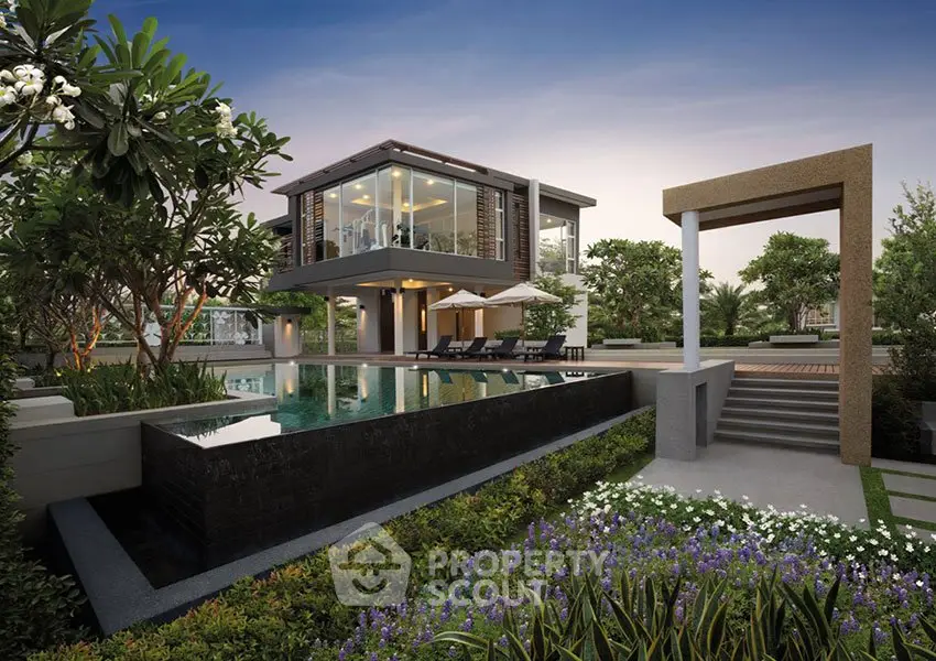 Luxurious modern house with pool and lush garden in serene setting
