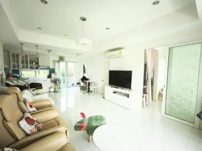 Spacious modern living room with open kitchen and stylish decor