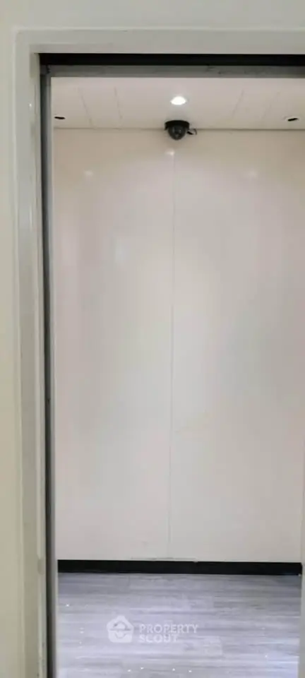 Modern elevator interior with sleek design and bright lighting