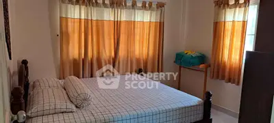 Cozy bedroom with natural light and stylish curtains
