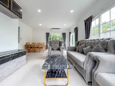 Spacious modern living room with elegant marble coffee table and plush seating