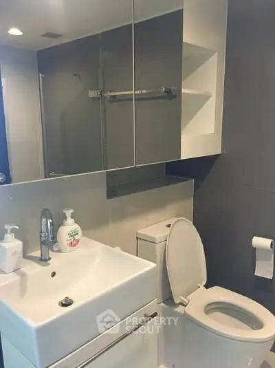 Modern bathroom with sleek fixtures and ample storage space