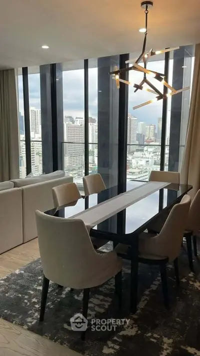 Modern dining area with stunning city view and elegant lighting