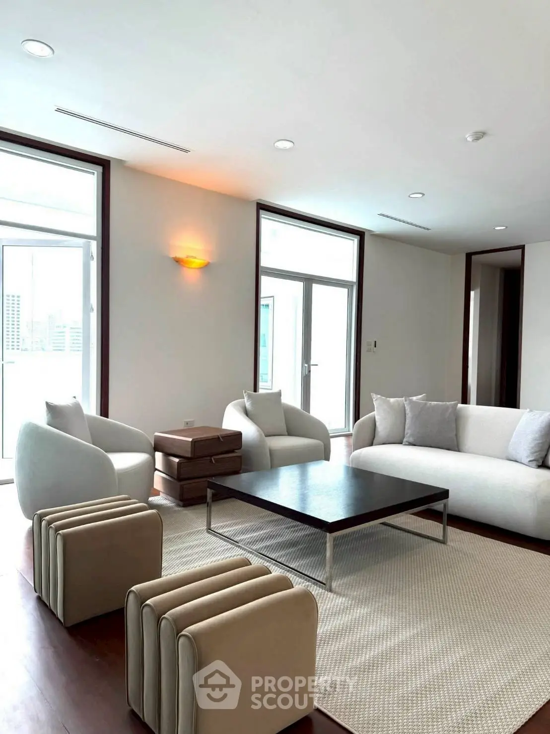 Spacious modern living room with elegant furniture and natural light