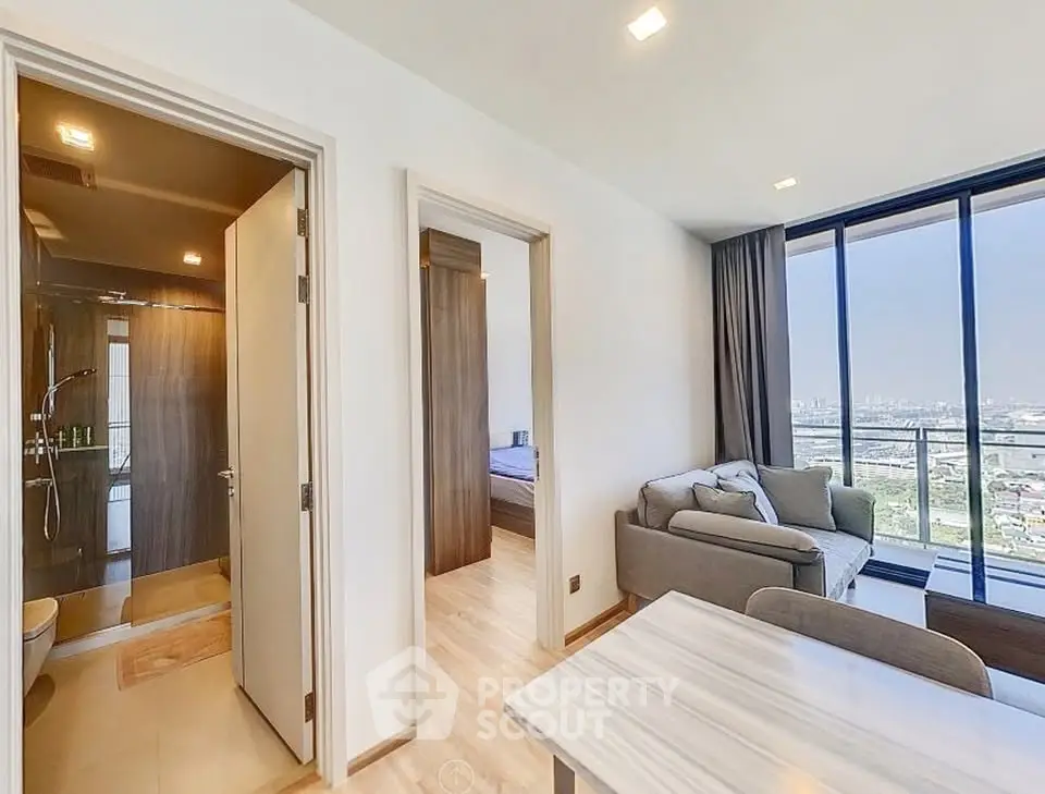 Modern apartment with open living area and stunning city view