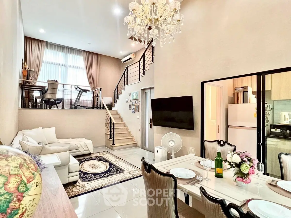 Luxurious duplex living room with elegant chandelier and modern decor
