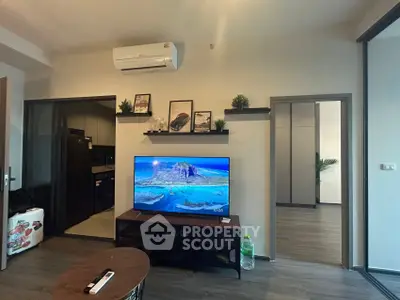 Modern living room with sleek TV setup and air conditioning