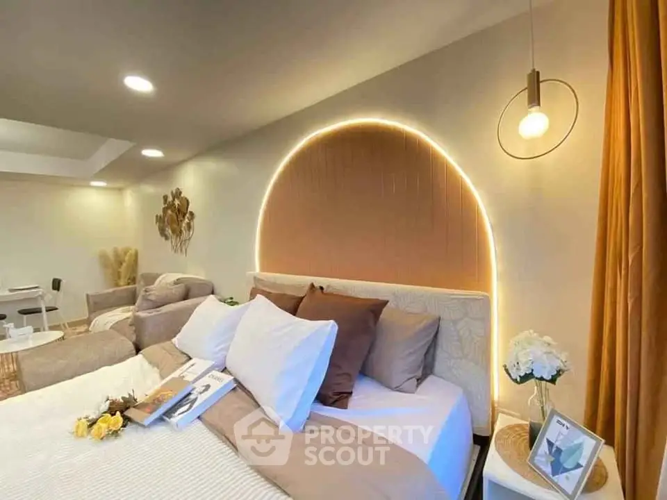 Luxurious bedroom with modern lighting and elegant decor, perfect for relaxation and comfort.