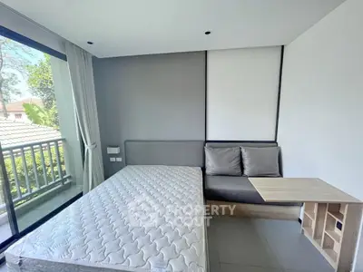 Modern bedroom with large window and minimalist decor