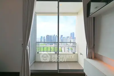 Modern apartment balcony with stunning city skyline view, perfect for urban living.