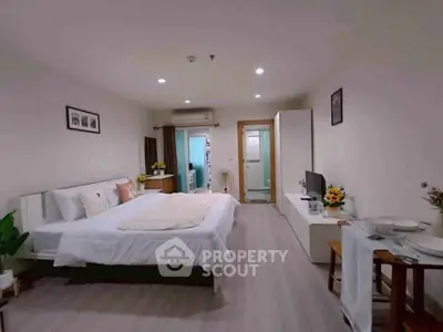 Spacious modern bedroom with elegant decor and cozy ambiance