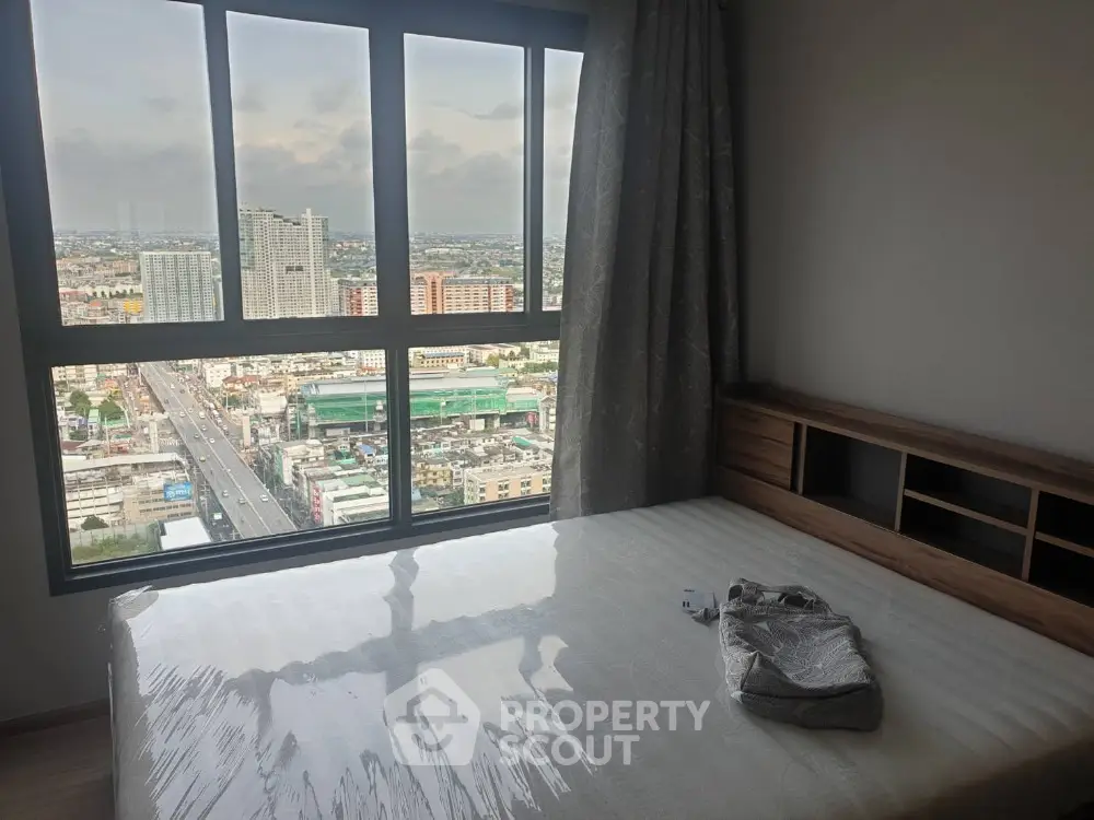 Modern bedroom with stunning city view from large window