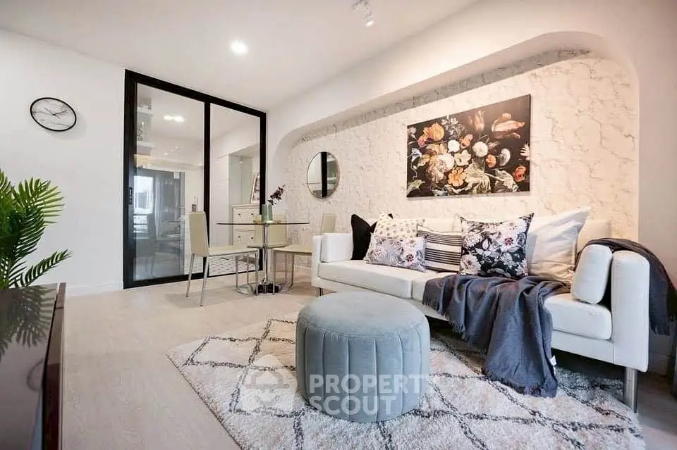 Stylish modern living room with elegant decor and cozy seating area.